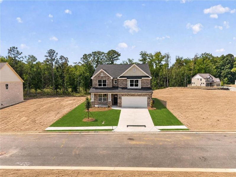 Front exterior of a new home in , Loganville, GA, highlighting curb appeal (Image 27).
