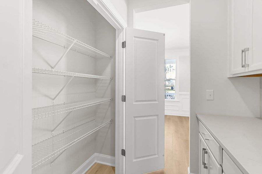 Spacious, unfurnished interior of a new home in Tidewater at Lakes of Cane Bay, Summerville (Image 33).