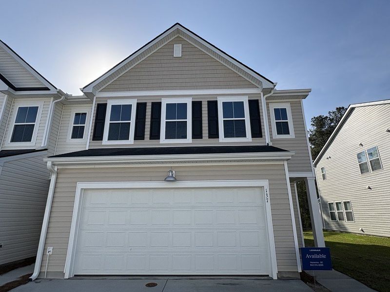 Front exterior of a new home in Dawson Pointe, Summerville, SC, highlighting curb appeal (Image 1). Front exterior of a new home in Dawson Pointe, Summerville, SC, highlighting curb appeal (Image 1).