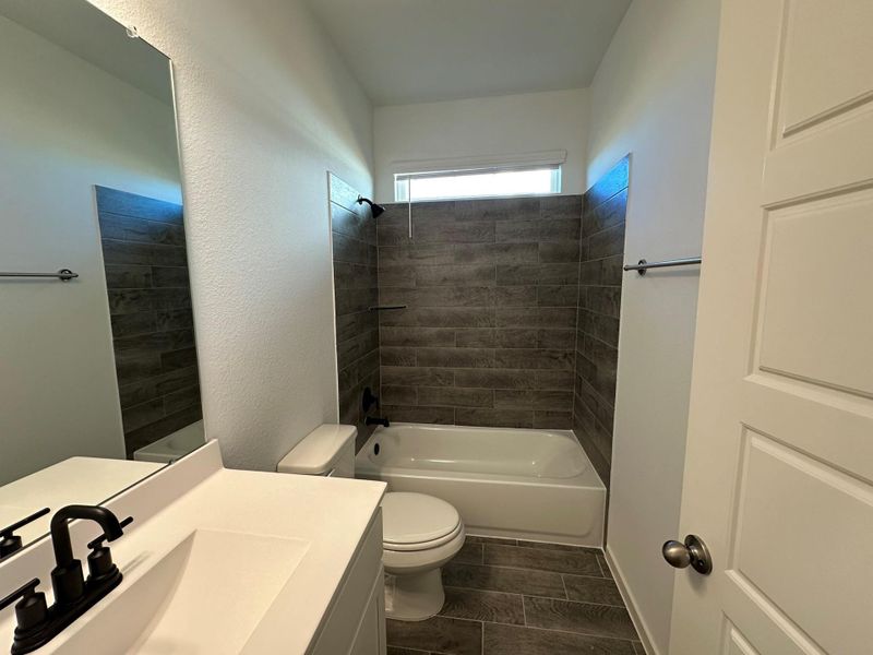 Furnished interior view inside a new home in , Iowa Colony (Image 11).