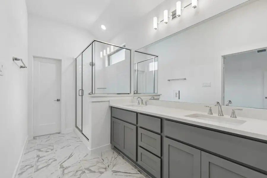 Primary Bathroom in the Claret home plan by Trophy Signature Homes – REPRESENTATIVE PHOTO