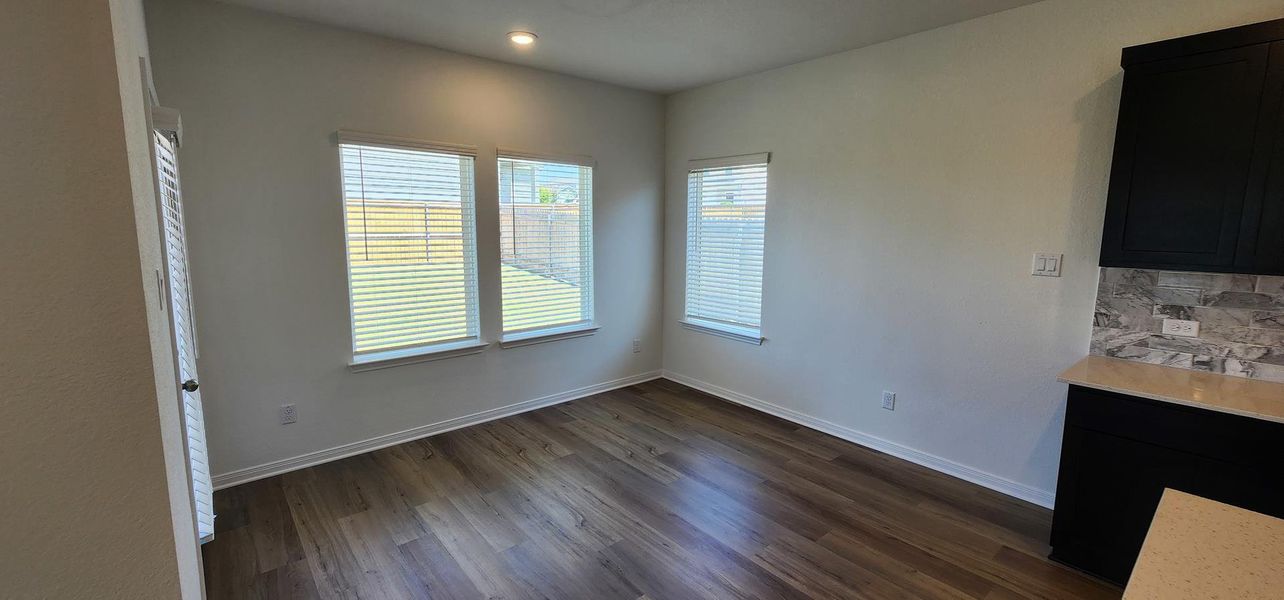 Vinyl plank flooring extends throughout this naturally illuminated space with views of the private backyard. Vinyl plank flooring extends throughout this naturally illuminated space with views of the private backyard.