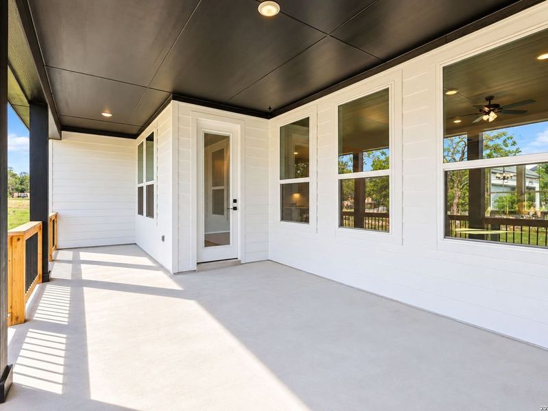 Exterior details and patio area of a home in Potranco Oaks, Castroville (Image 28).