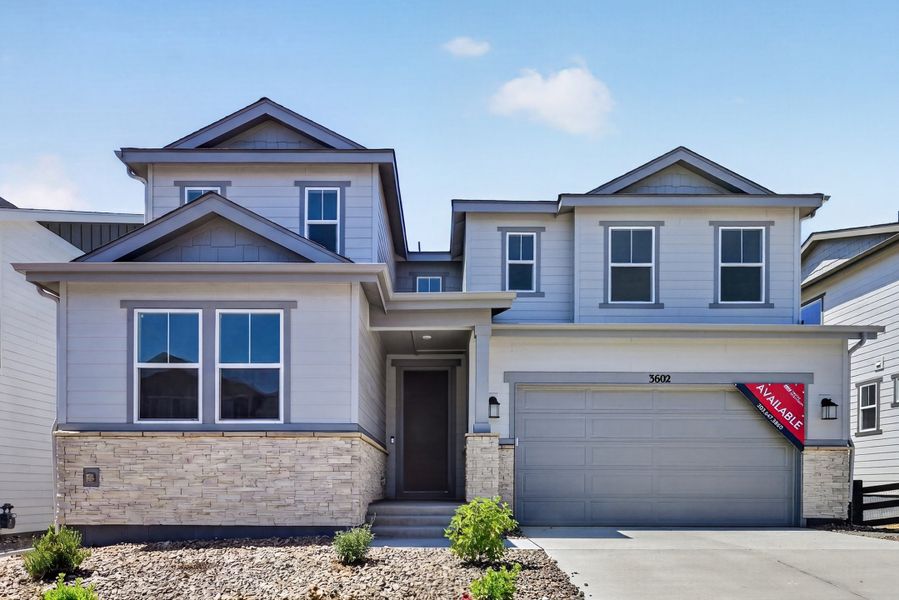 Front exterior of a new home in Macanta, Castle Rock, CO, highlighting curb appeal (Image 1). Front exterior of a new home in Macanta, Castle Rock, CO, highlighting curb appeal (Image 1).