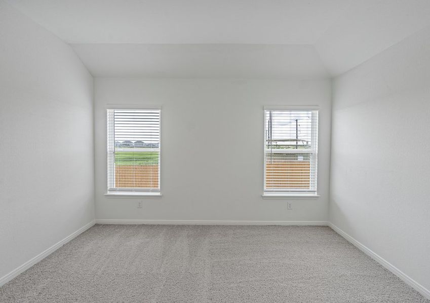 Master bedroom with two windows and ceiling fan light fixture