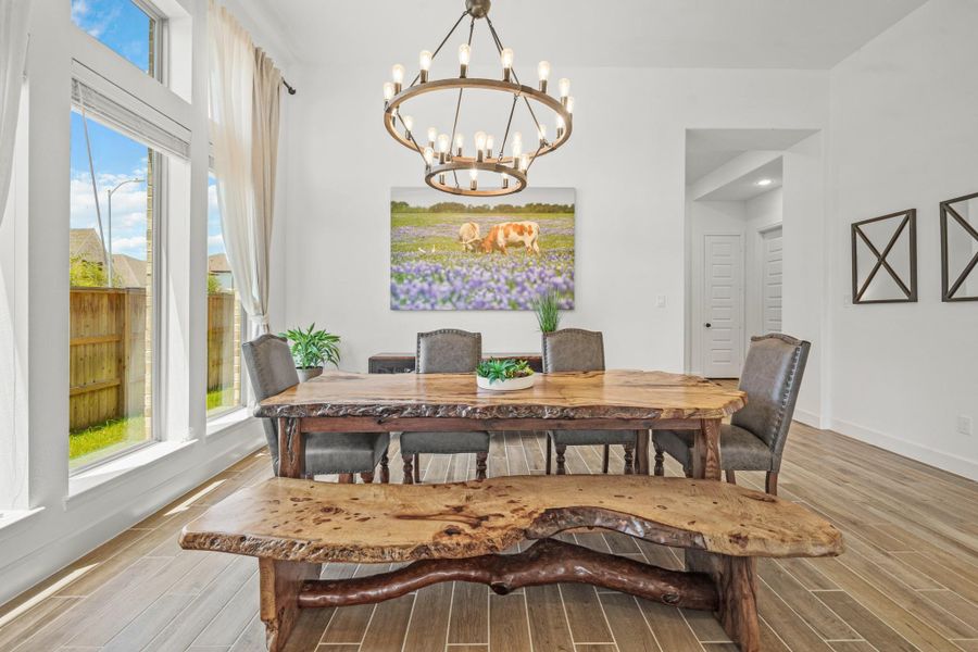 Bright dining area featuring large windows, plenty of space for a large dining table, perfect for family gatherings.