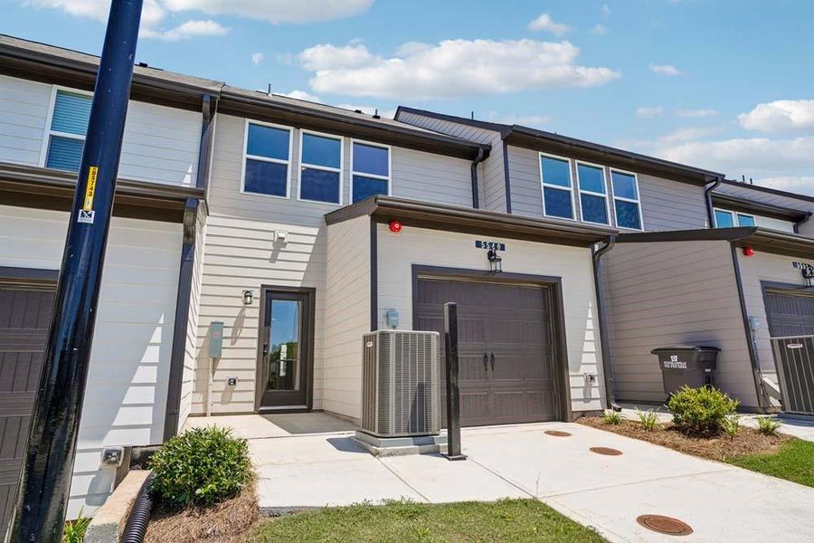 Front exterior of a new home in Laurelwood, Douglasville, GA, highlighting curb appeal (Image 22). Front exterior of a new home in Laurelwood, Douglasville, GA, highlighting curb appeal (Image 22).
