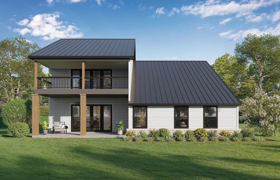 Back of house featuring a standing seam roof, a patio area, a balcony, and a lawn