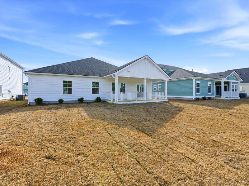 Exterior details and patio area of a home in The Coves at Lakes of Cane Bay II, Summerville (Image 3).