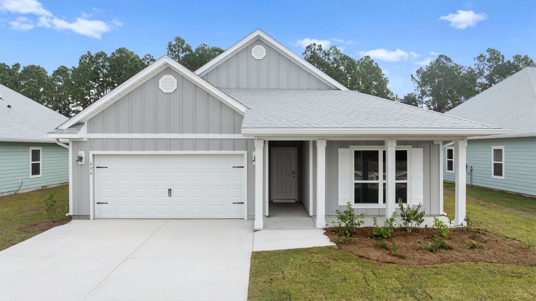 Front exterior of a new home in Buffer Farms, Port Saint Joe, FL, highlighting curb appeal (Image 1).