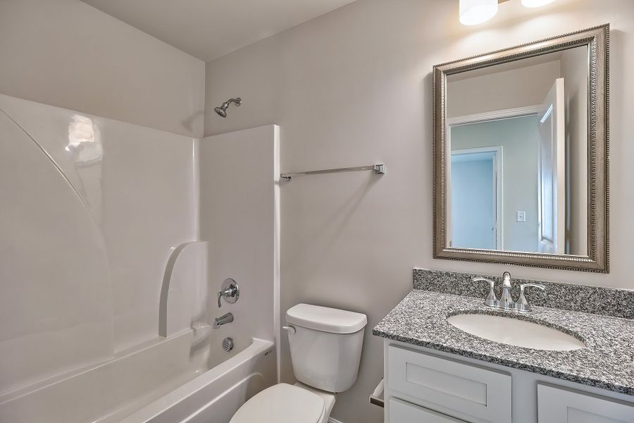 Representative furnished interior of a home built from the Juniper by McGuinn Homes in Hunters Branch, Hopkins (Image 7).