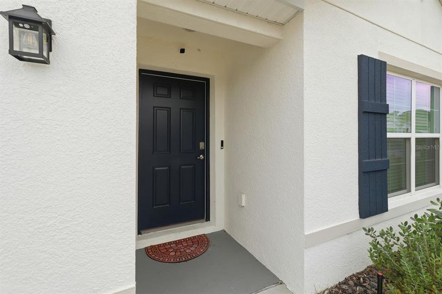 Exterior details and patio area of a home in Autumn Glen, Belleview (Image 18).
