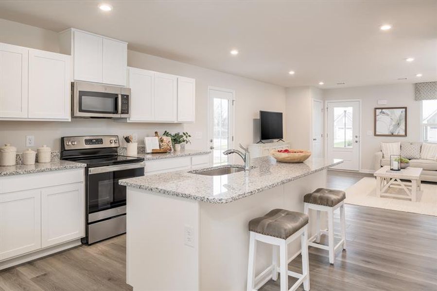Representative furnished interior of a home built from the Tate by Ryan Homes in Middle Creek Village Coastal Cottages & Villas, Bolivia (Image 7).