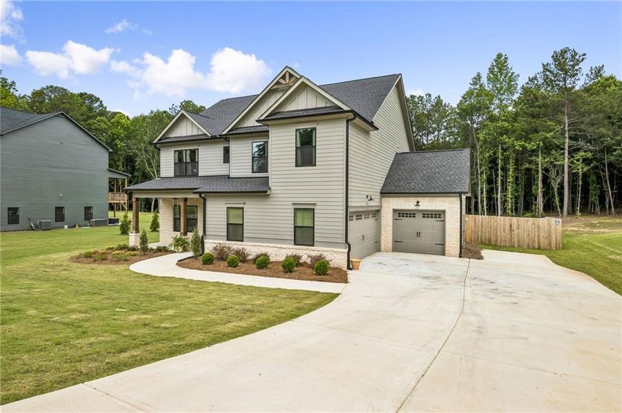 Front exterior of a new home in , Winder, GA, highlighting curb appeal (Image 26). Front exterior of a new home in , Winder, GA, highlighting curb appeal (Image 26).