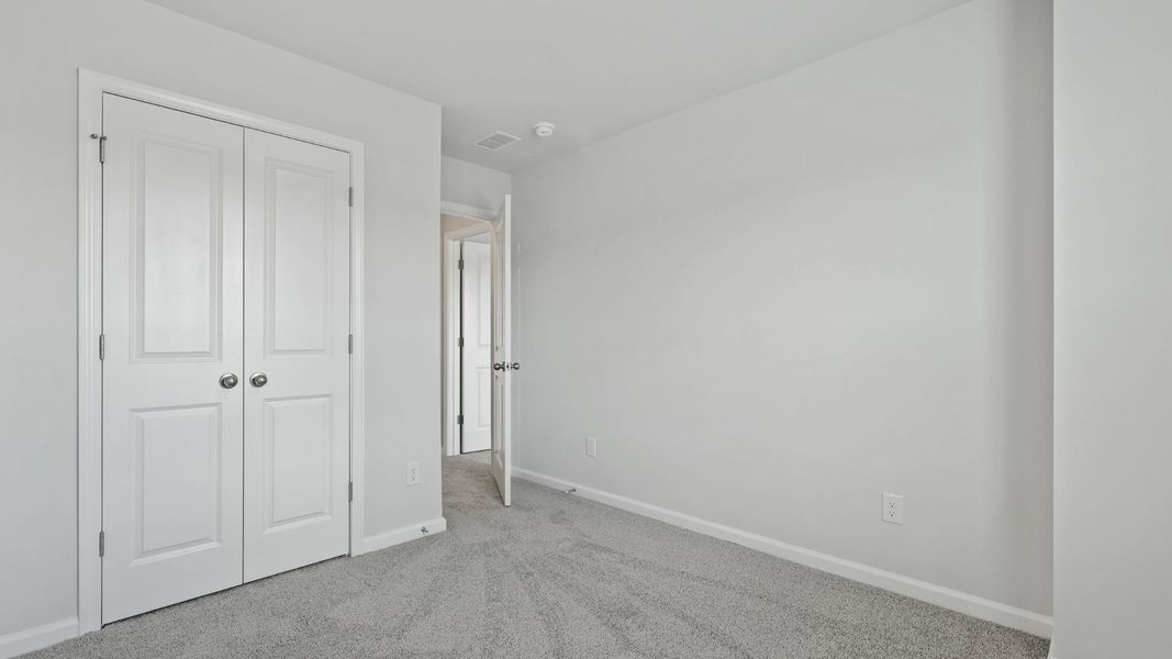 Spacious, unfurnished interior of a new home in Pine Hills Townhomes at Cane Bay, Summerville (Image 18).