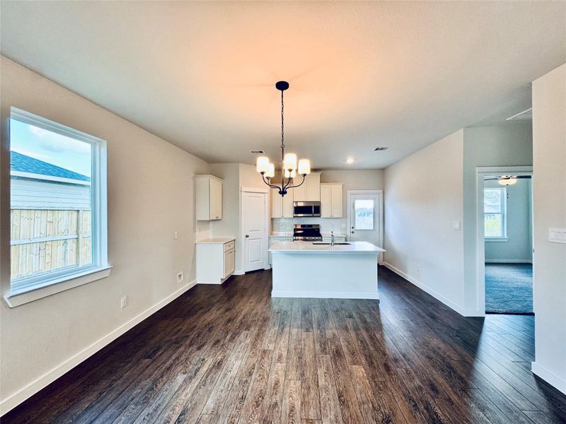 The open-concept layout creates a seamless flow, making it an ideal space for entertaining guests or enjoying quality time with your loved ones.