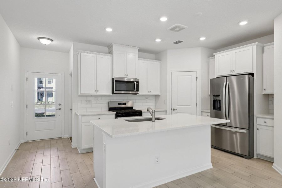 Furnished interior view inside a new home in Brandon Lakes at Silver Landing, St. Augustine (Image 9).