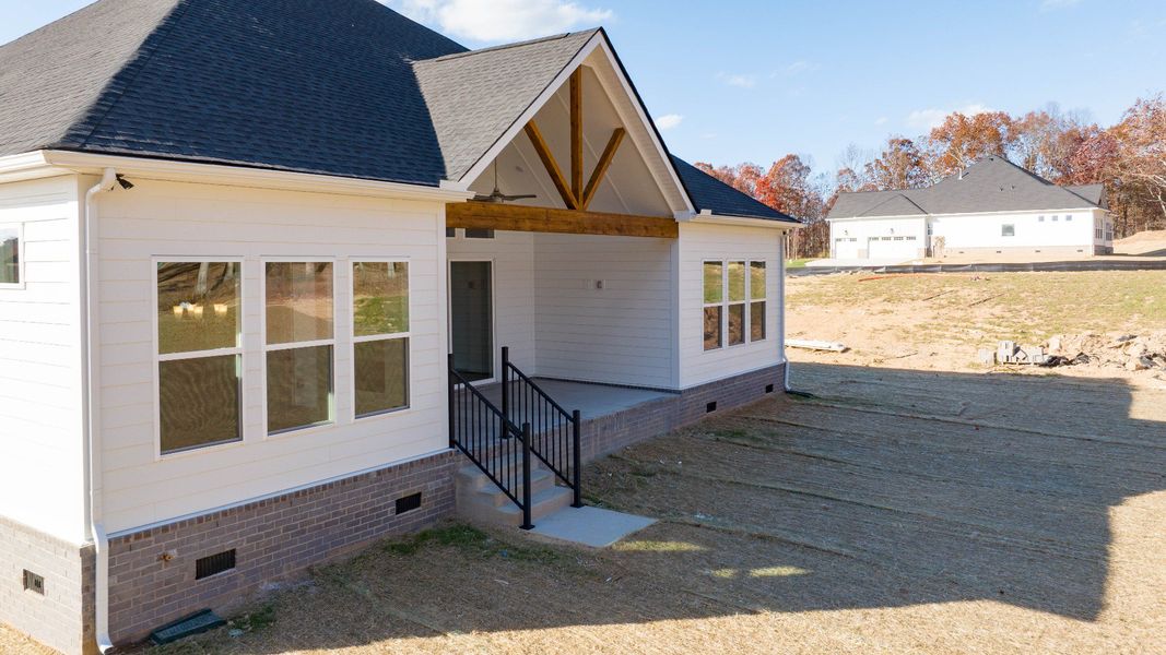 Rear of home with covered back patio