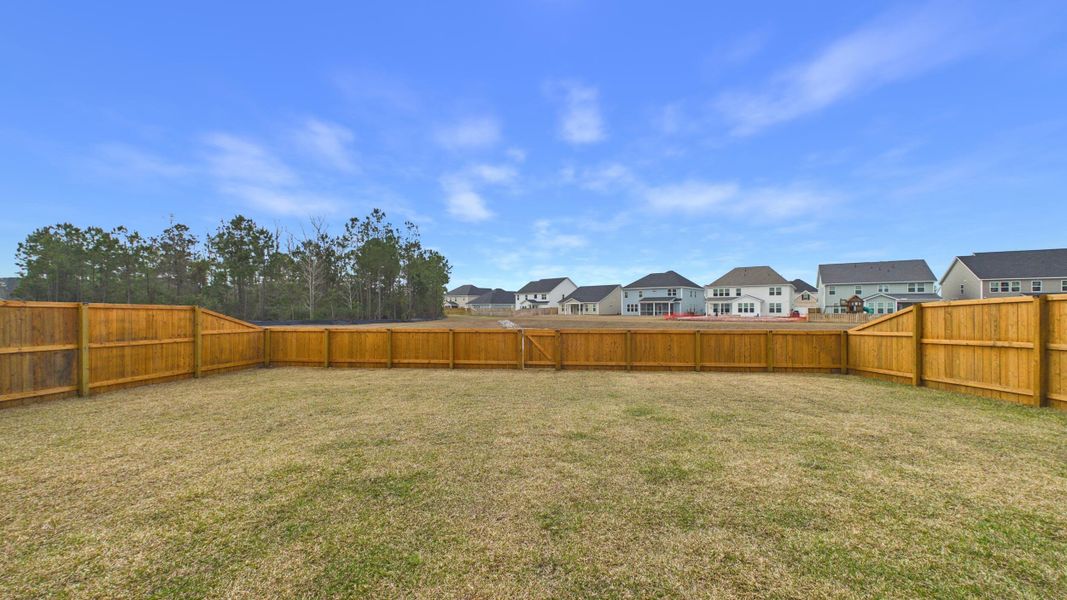 Exterior details and patio area of a home in Hewing Farms, Summerville (Image 28).