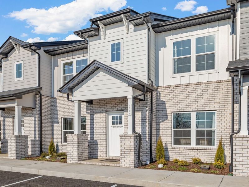 Front exterior of a new home in The Towns at Red River, Gallatin, TN, highlighting curb appeal (Image 24). Front exterior of a new home in The Towns at Red River, Gallatin, TN, highlighting curb appeal (Image 24).