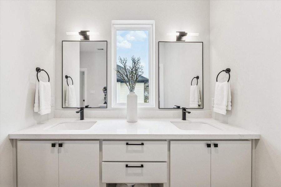 An additional view of the vanity in the primary suite.