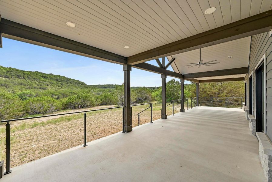 This incredible oversized back porch provides you with ample space for living, dining, entertaining, a grill station, and more. This incredible oversized back porch provides you with ample space for living, dining, entertaining, a grill station, and more.