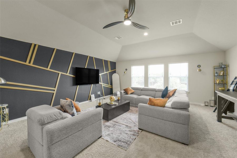 Spacious game room offers the perfect setting for movie nights and gatherings.