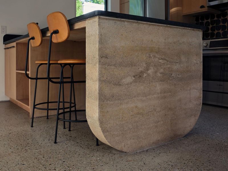 The rammed earth result is a structure where form and function meetin perfect harmony.