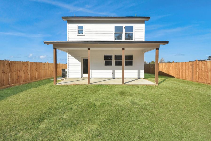 Exterior details and patio area of a home in , Conroe (Image 25).