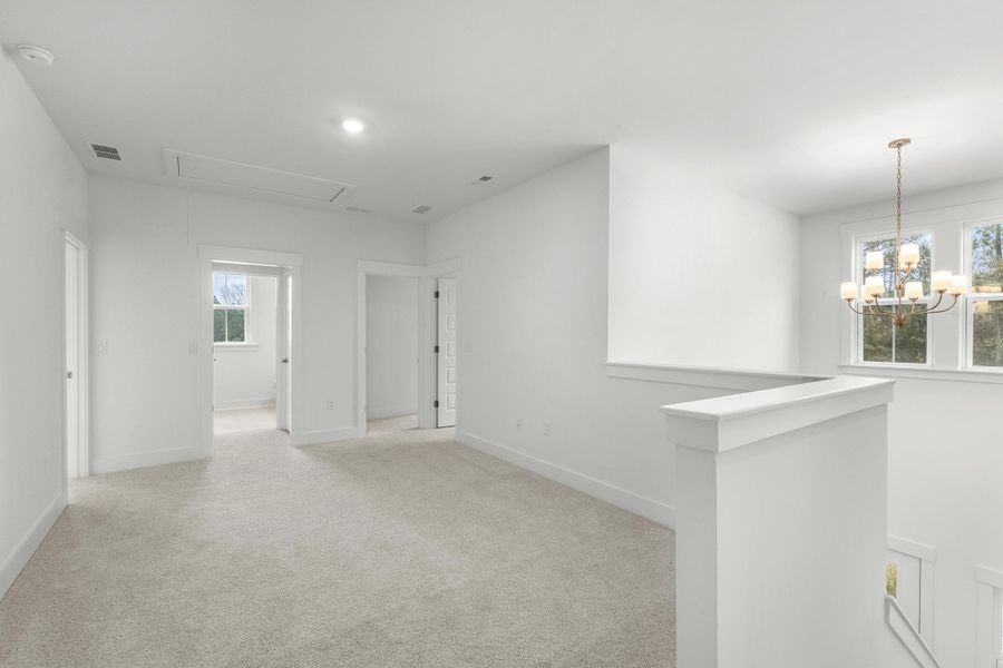 Spacious, unfurnished interior of a new home in Long Bay Golf Club, Longs (Image 32).