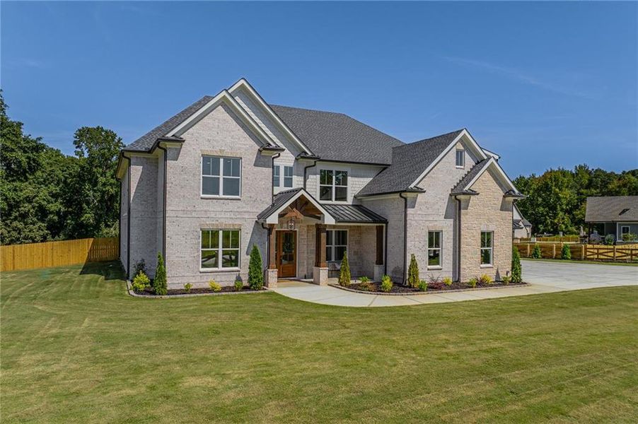 Front exterior of a new home in , Dacula, GA, highlighting curb appeal (Image 31).