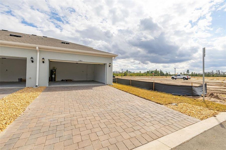 Exterior details and patio area of a home in Serenade at Ovation, Winter Garden (Image 3). Exterior details and patio area of a home in Serenade at Ovation, Winter Garden (Image 3).