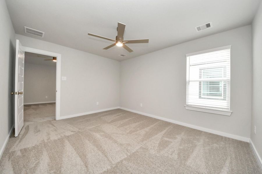 Generously sized secondary bedrooms featuring spacious closets, soft and inviting carpeting underfoot, large windows allowing plenty of natural light, and the added touch of privacy blinds for your personal retreat.