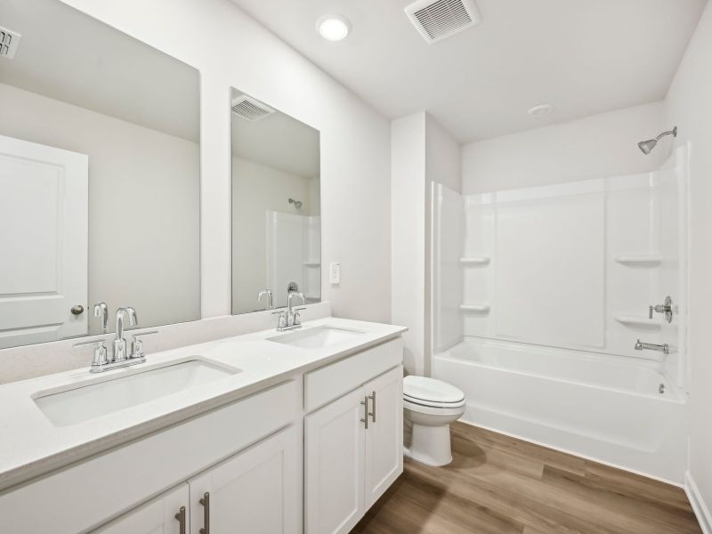 Furnished interior view inside a new home in Martin Springs - Estate Series, Lawrenceville (Image 10).