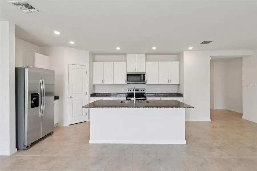 Furnished interior view inside a new home in Crosswinds - Signature Series, Haines City (Image 7).