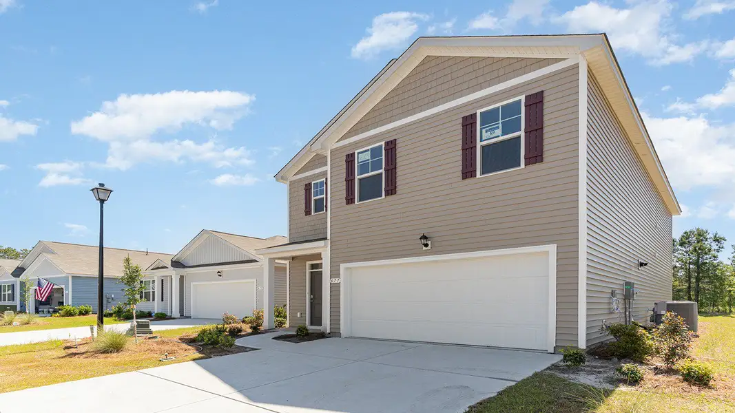 Representative exterior photo of a completed home built from the ROBIE by D.R. Horton in Sandridge Park, Little River, SC (Image 2).