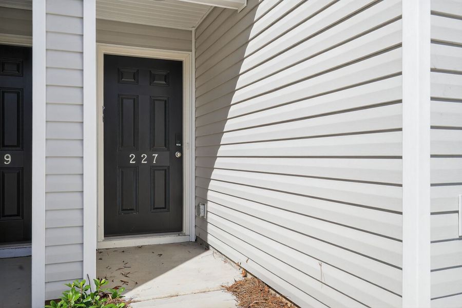 A white house with a black door.