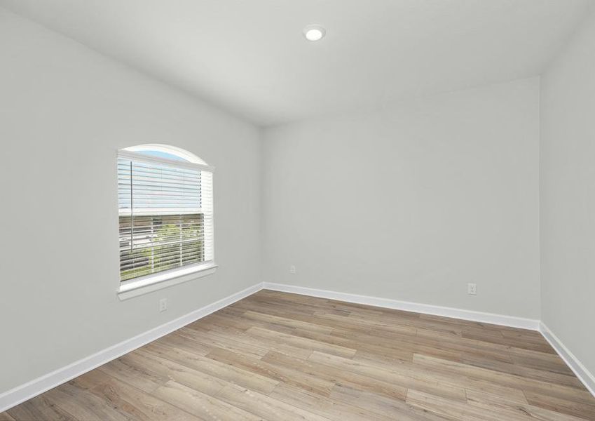 Formal dining room with plank flooring