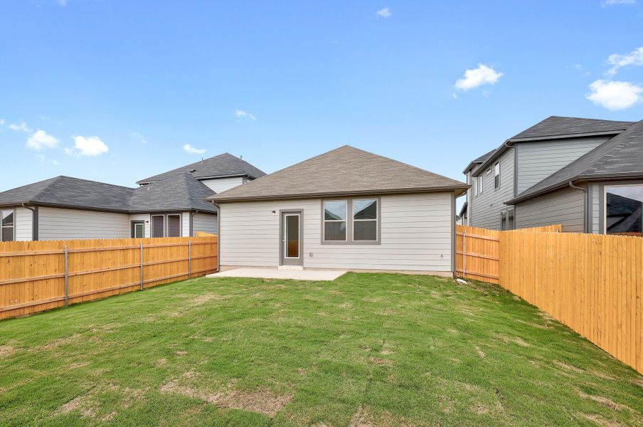 Exterior details and patio area of a home in Trinity Ranch, Elgin (Image 19).