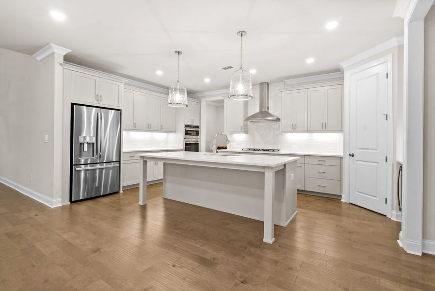 Representative furnished interior of a home built from the The McIntosh by The Providence Group in Promenade at Sawnee Village, Cumming (Image 8).
