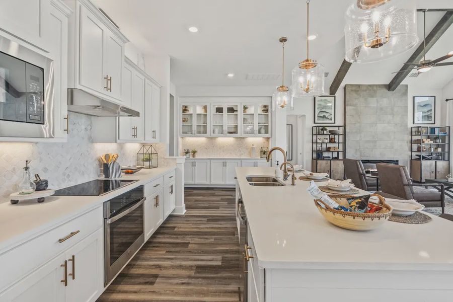 Representative furnished interior of a home built from the Mia by Chesmar Homes in Sweetwater, Austin (Image 6).