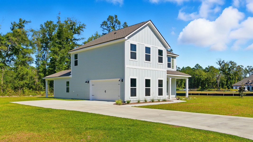 Front exterior of a new home in Greystone, Crawfordville, FL, highlighting curb appeal (Image 2).