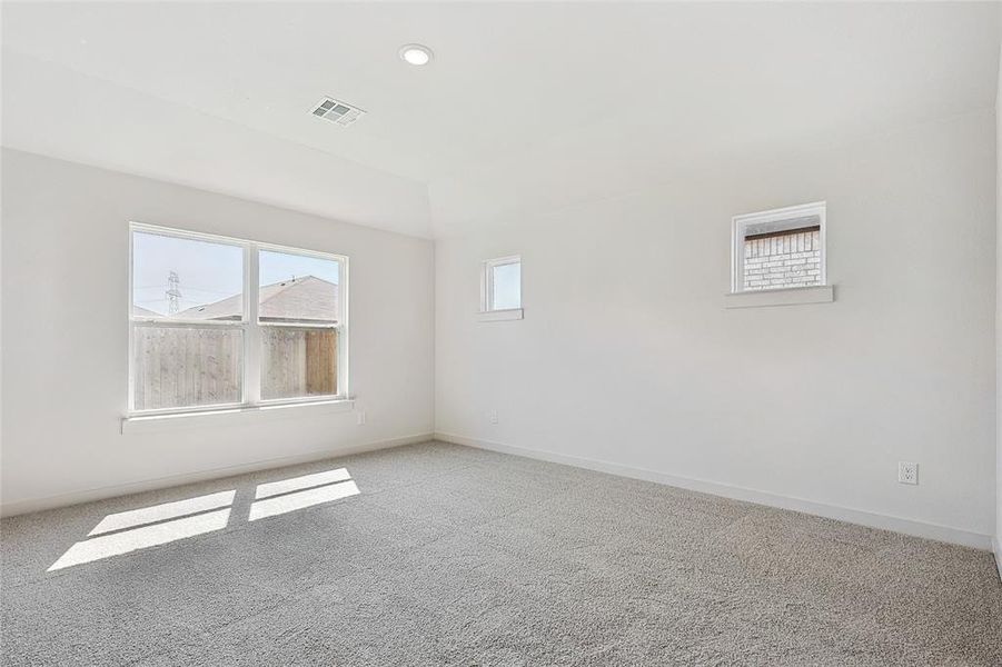 Spare room featuring light colored carpet