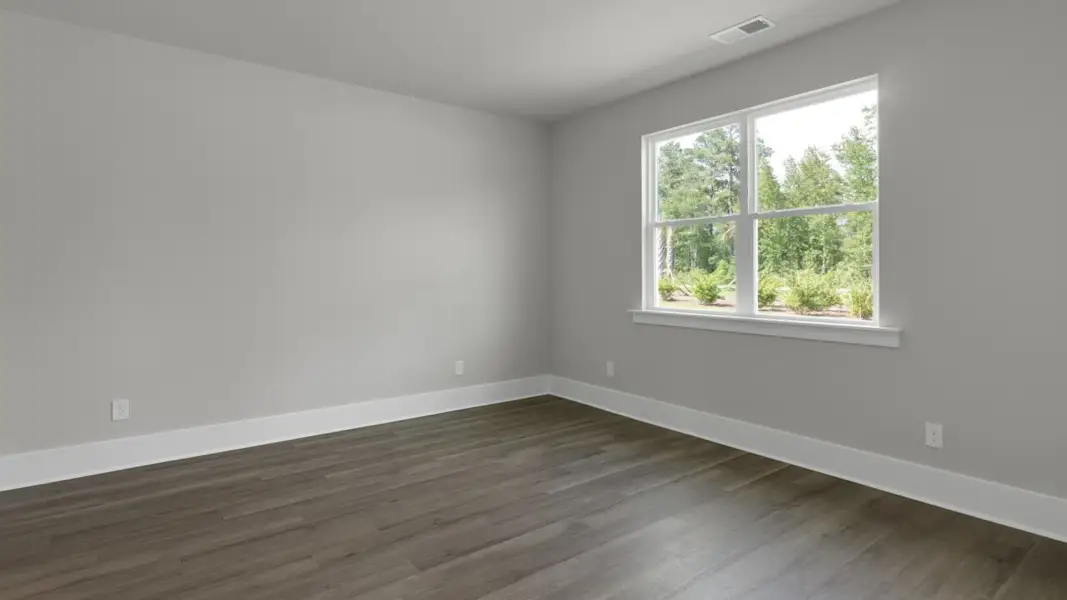 Spacious, unfurnished interior of a new home in The Retreat at Indigo Preserve Townhomes, Leland (Image 18).