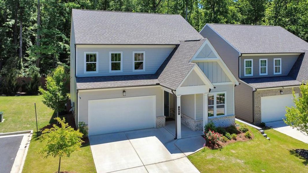 Front exterior of a new home in , Holly Springs, GA, highlighting curb appeal (Image 2). Front exterior of a new home in , Holly Springs, GA, highlighting curb appeal (Image 2).