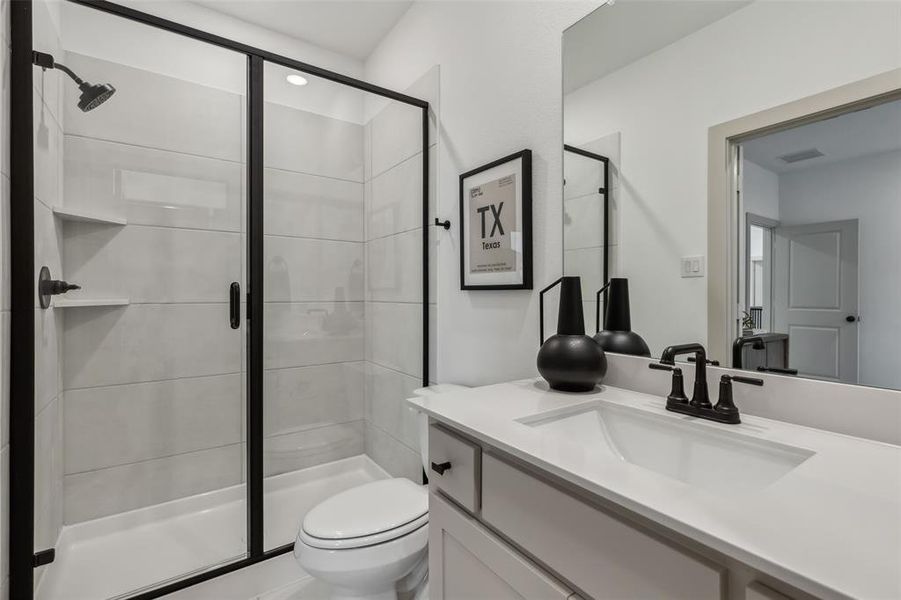 Guests will feel right at home in either of the beautifully finished guest baths our Marcel plan has to offer.
