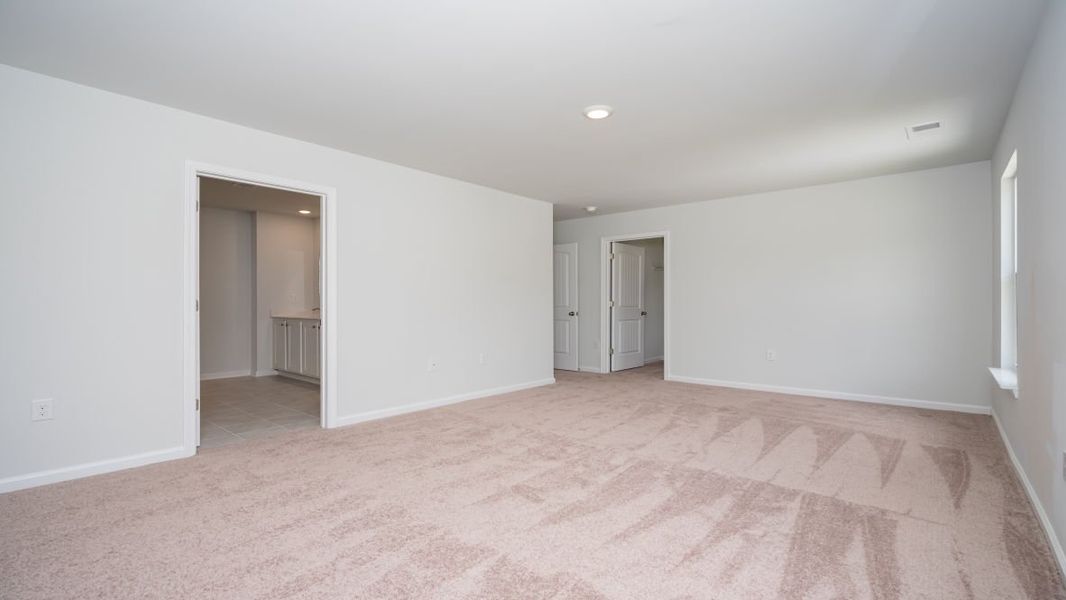 Representative unfurnished interior of a home built from the ROBIE by D.R. Horton in Indigo Preserve, Leland (Image 34).