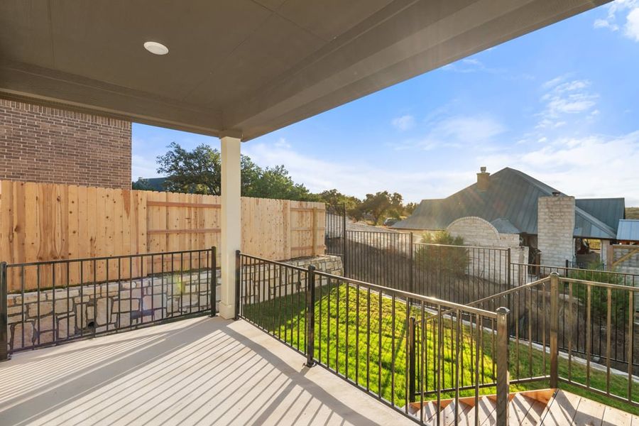 Exterior details and patio area of a home in Terrace Collection at Lariat, Liberty Hill (Image 24).
