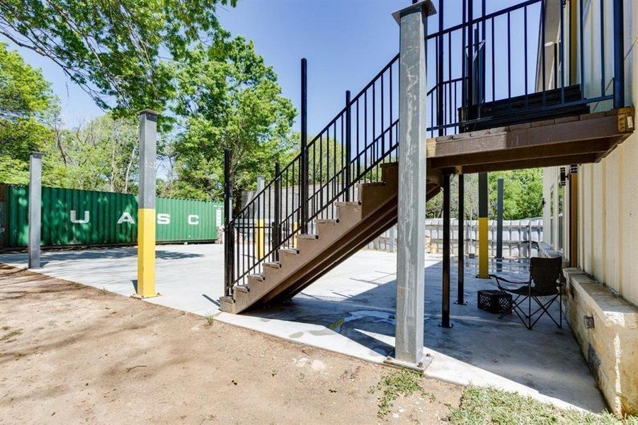 View of patio featuring stairway