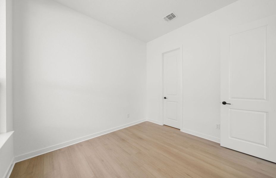 Representative unfurnished interior of a home built from the Dobbin by Pulte Homes in 6 Creeks, Kyle (Image 19).